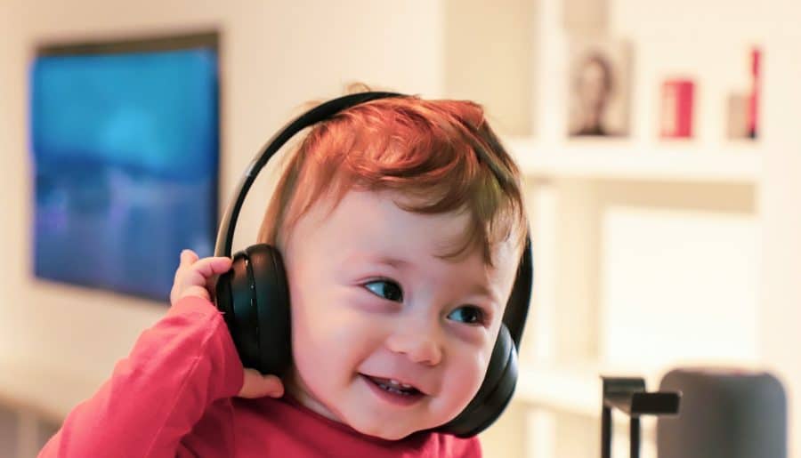baby listening in black headset