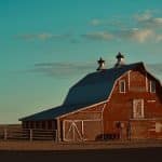 red wooden barn under blue sky during daytime