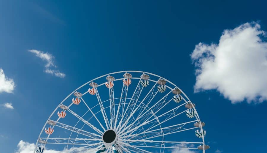 a large ferris wheel sitting under a blue sky