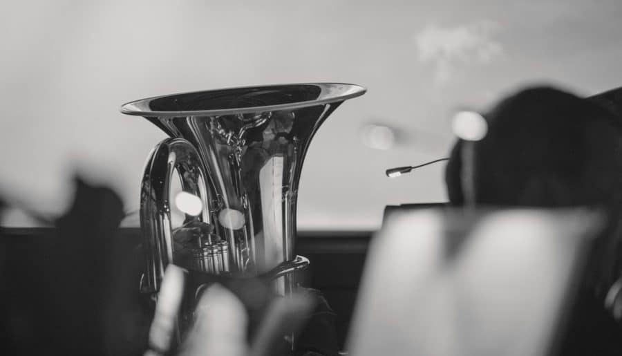 a person holding a glass cup