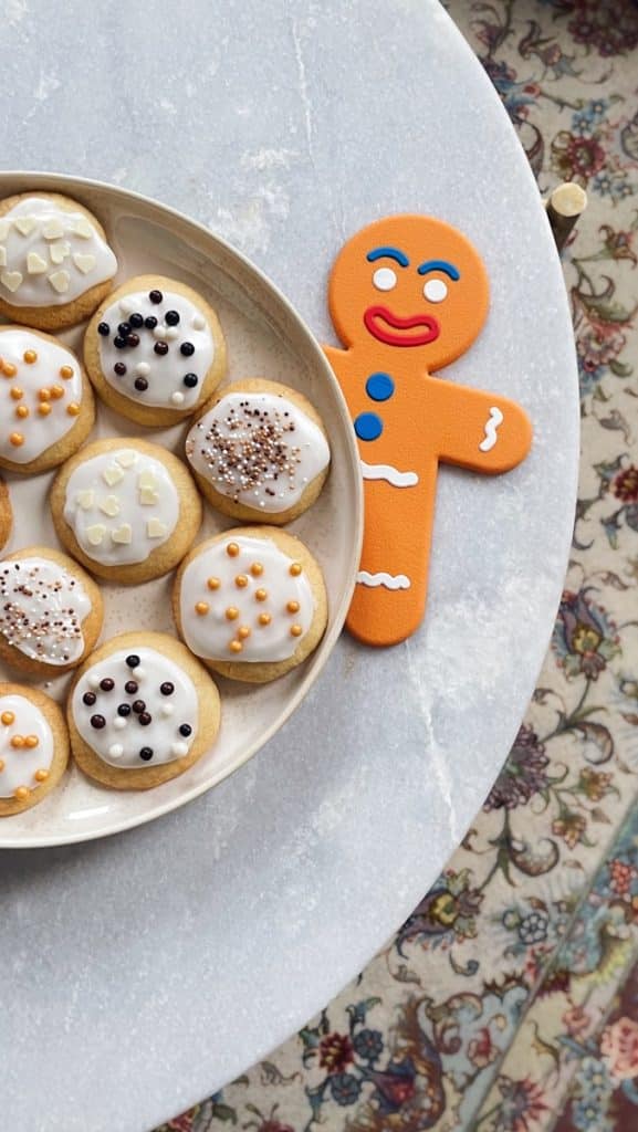 a plate of decorated cookies on a table